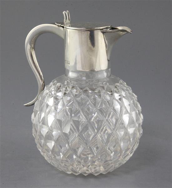 A late Victorian silver mounted cut glass claret jug by John Newton Mappin, 18cm.
